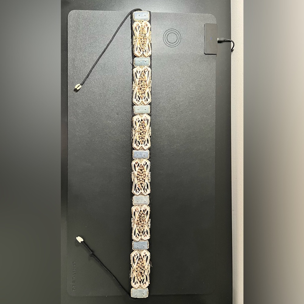 Sea shell belt by “trendy girl” about 52 inches long with different color shells